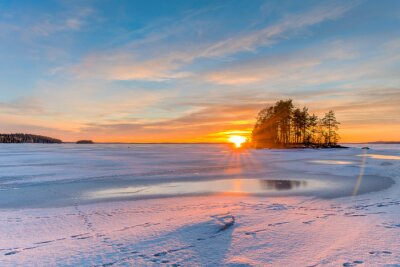 Tableau  Sunset over frozen lake in Finland