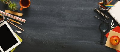 Tableau  Supplies for school border on black chalkboard, panorama