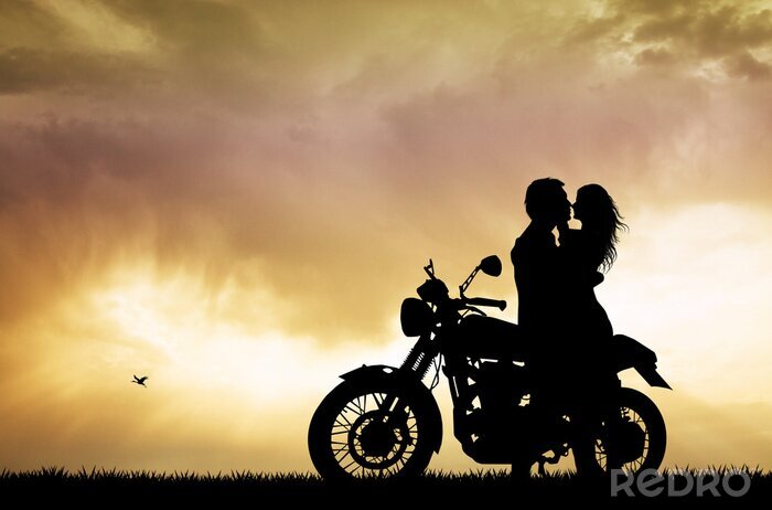 Tableau  Un couple à moto au coucher du soleil