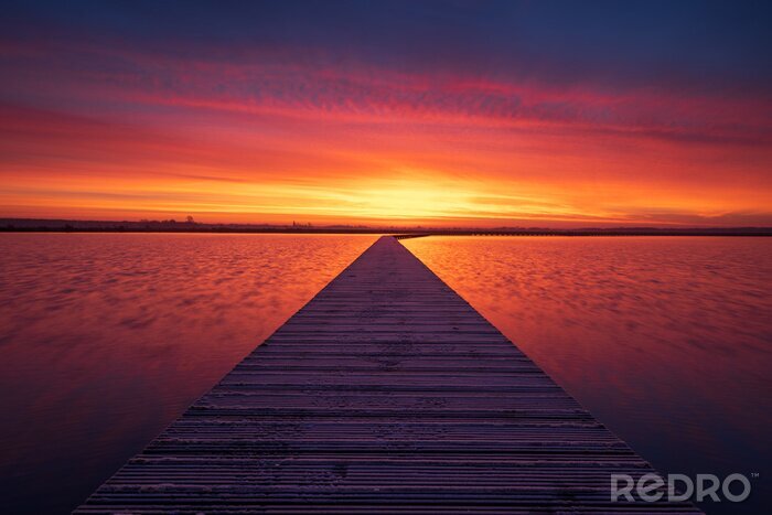 Tableau  Very colorful and tranquil dawn at a jetty in a lake. Groningen, Holland.