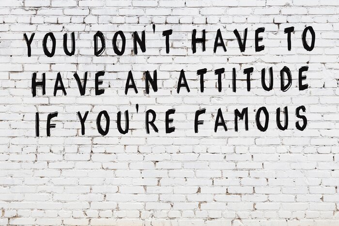 Tableau  White brick wall with painted black inscription of wise quote