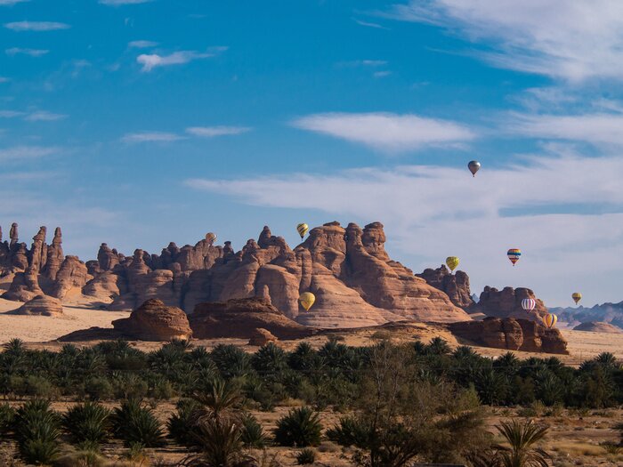 Tableau  Winter at Tantora Hot Air Balloon Festival over Mada'in Saleh (Hegra) ancient site, Al Ula, Saudi Arabia