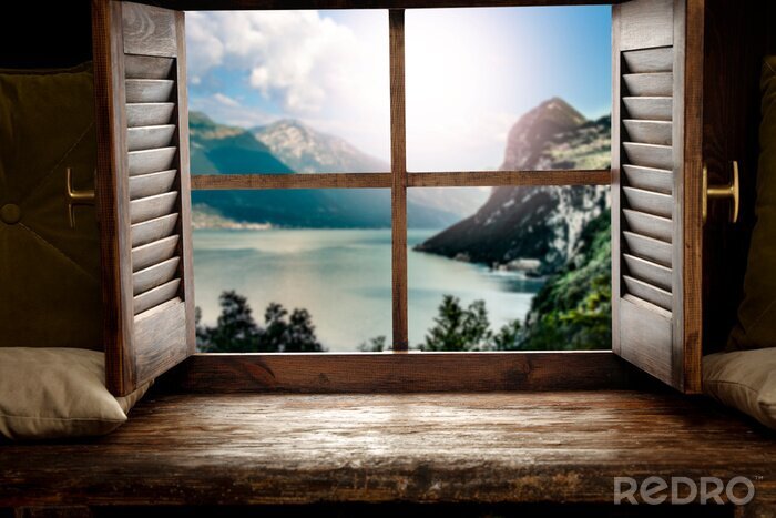Tableau  Wooden window sill background with pillows and free space for your decoration.Landscape of spring lake with mountains nad copy space 