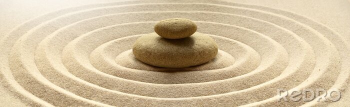 Tableau  zen garden meditation stone background with stones and lines in sand for relaxation balance and harmony spirituality or spa wellness